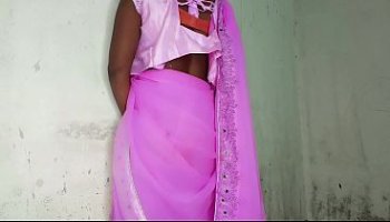I am an Indian woman ready to have sex while wearing a pink Indian saree.